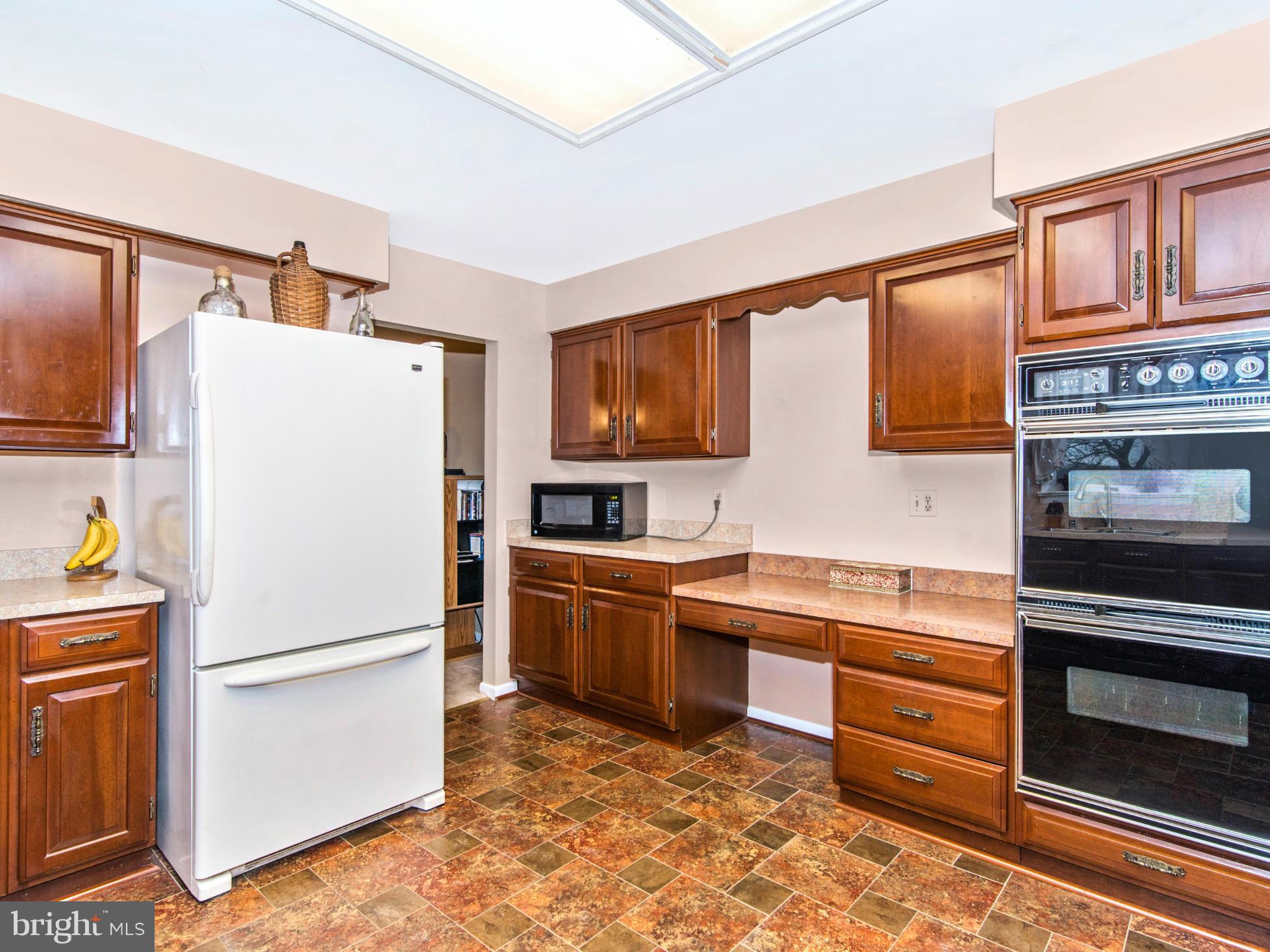 14040 Liberty Road Union Bridge, MD 21791 - Photo 8 of 30 a kitchen with a refrigerator and a stove top oven