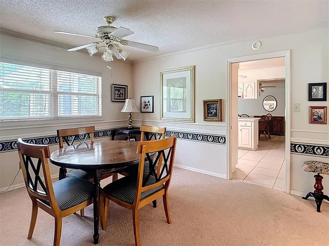 a kitchen with white cabinets and appliances