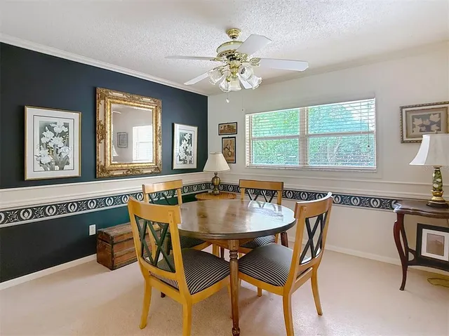 a kitchen with cabinets stainless steel appliances and a window
