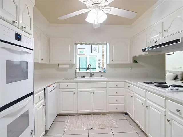 a view of a a dining room with furniture window and wooden floor