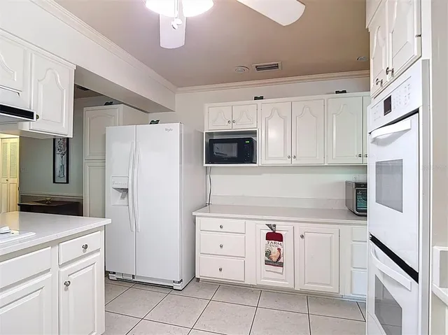 a living room with furniture large window and a fireplace