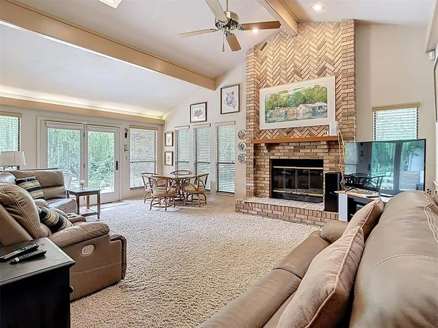 a bedroom with a bed and a dresser next to a window