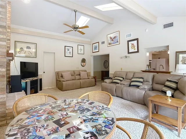 a bedroom with a bed and a dresser in it