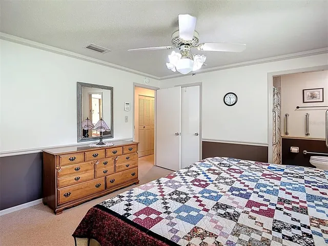 a bedroom with a bed and a table