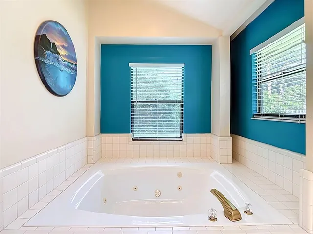 a bathroom with a double vanity sink and mirror