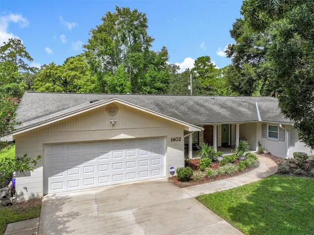 a view of a potted plant in front of a house
