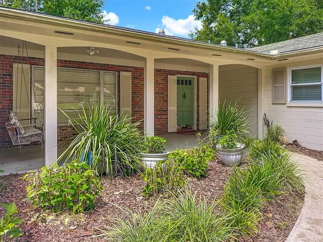 a view of backyard with outdoor seating