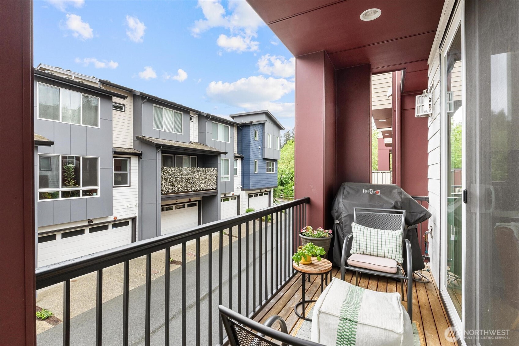 513 238th Street Southeast, Unit A Bothell, WA 98021 - Photo 20 of 31 a view of a balcony with chair and floor to ceiling window