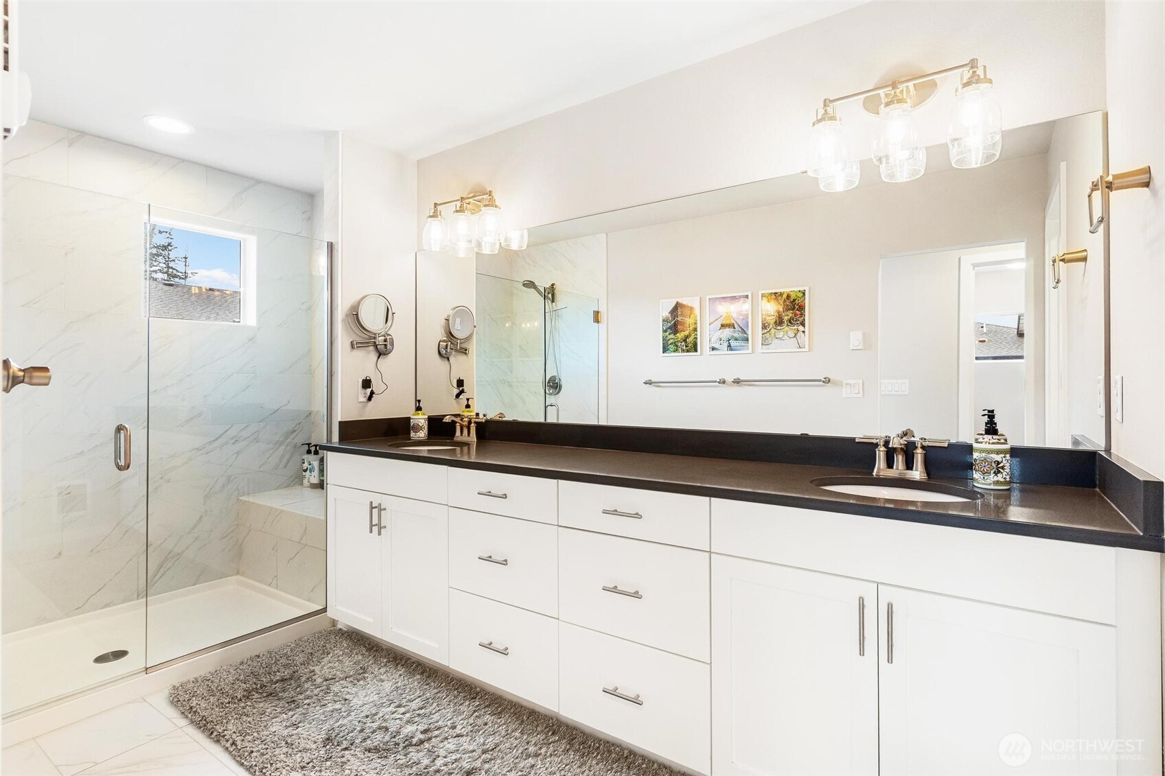 513 238th Street Southeast, Unit A Bothell, WA 98021 - Photo 22 of 31 a bathroom with a granite countertop sink a mirror and a shower