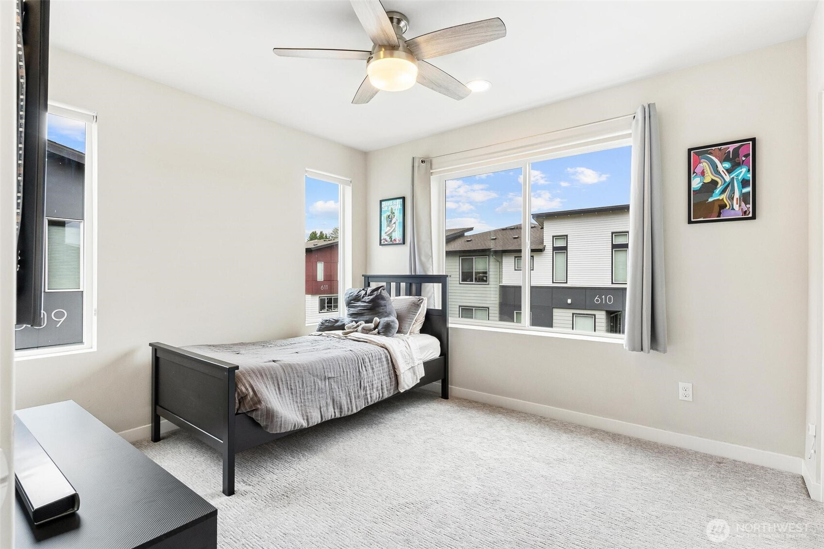 513 238th Street Southeast, Unit A Bothell, WA 98021 - Photo 29 of 31 a living room with a bed furniture and a window