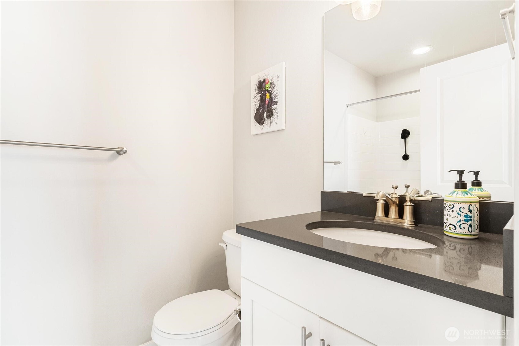 513 238th Street Southeast, Unit A Bothell, WA 98021 - Photo 30 of 31 a bathroom with a granite countertop sink a toilet and mirror