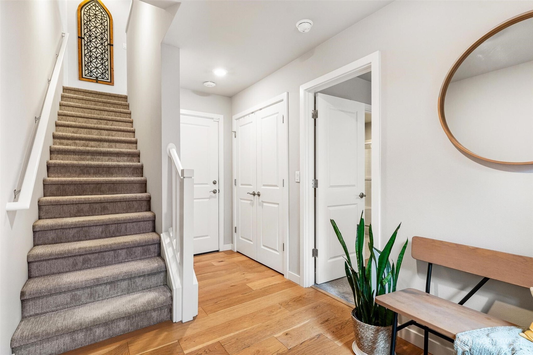 513 238th Street Southeast, Unit A Bothell, WA 98021 - Photo 6 of 31 a view of a room with wooden floor and a potted plant