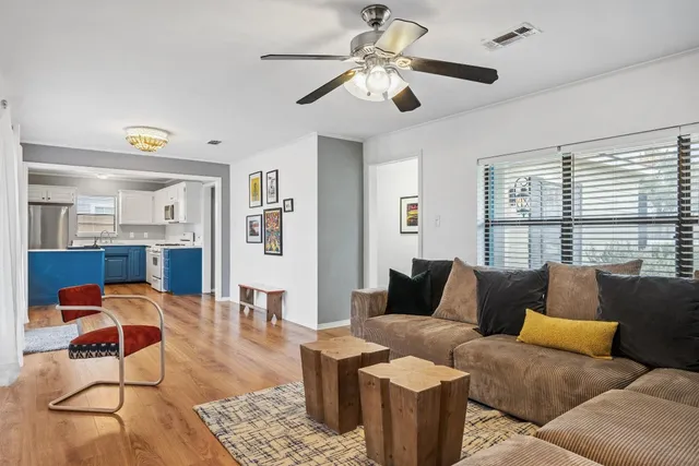 a kitchen with a refrigerator and a sink