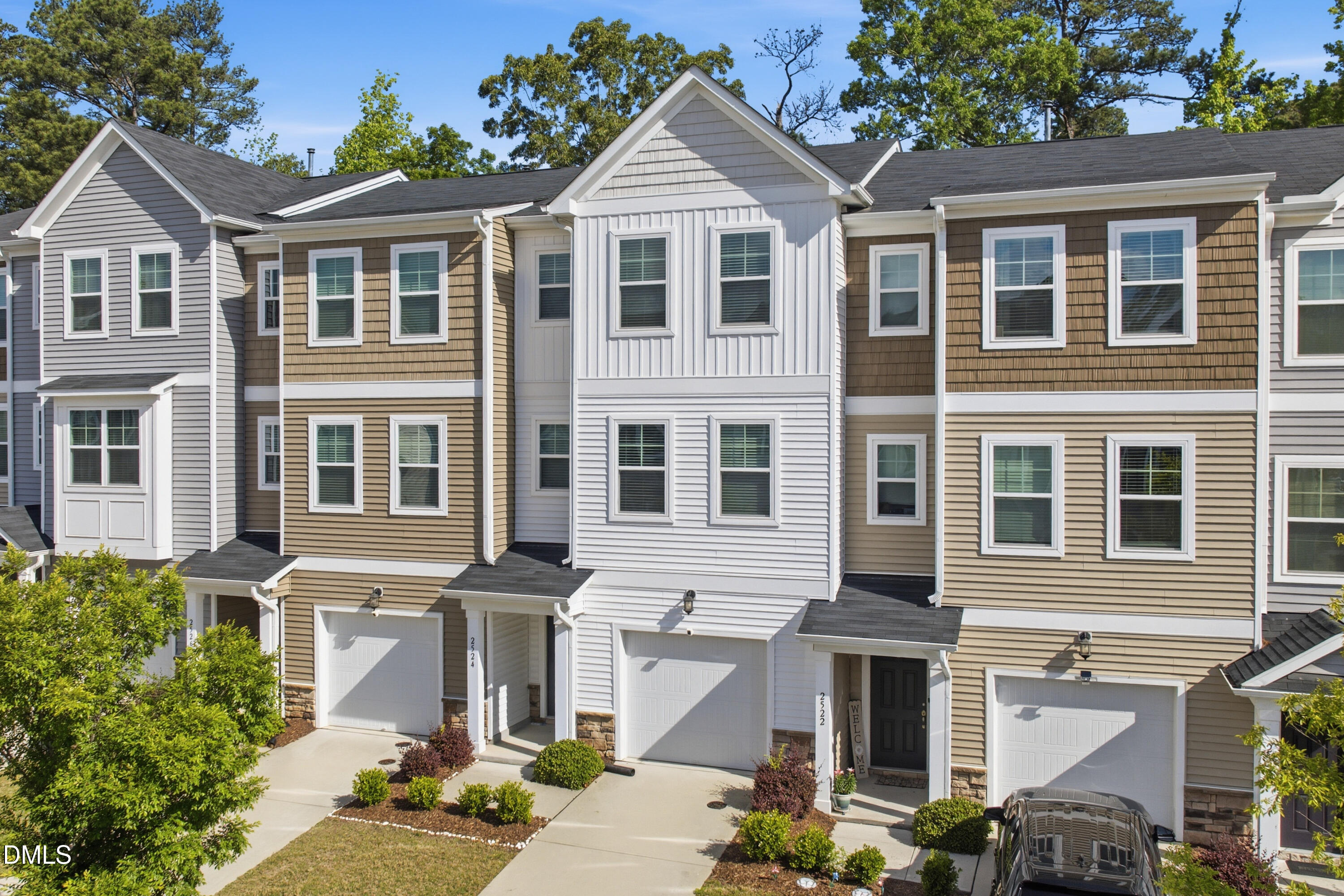 2524 Laurel Valley Way Raleigh, NC 27604 - Photo 3 of 12 a front view of a residential apartment building with a yard