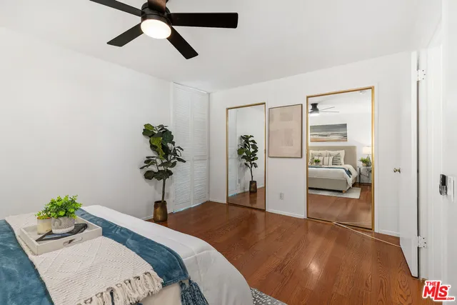 a bedroom with a bed and hallway