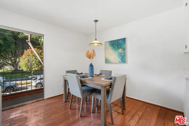 a dining room with furniture window wooden floor