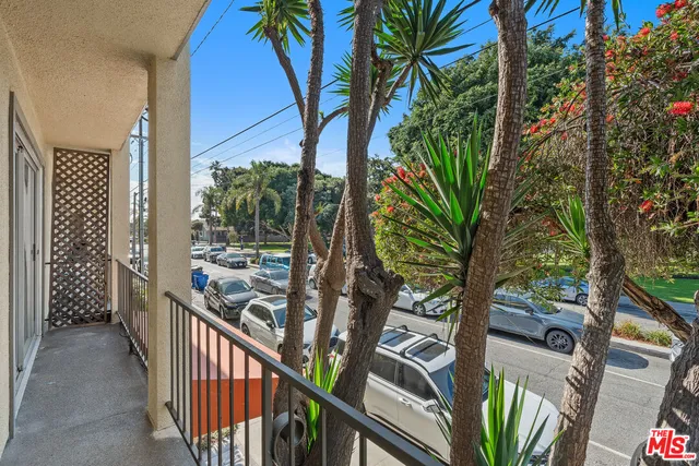 a view of balcony with wooden floor