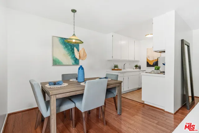 a kitchen with a table and chairs in it