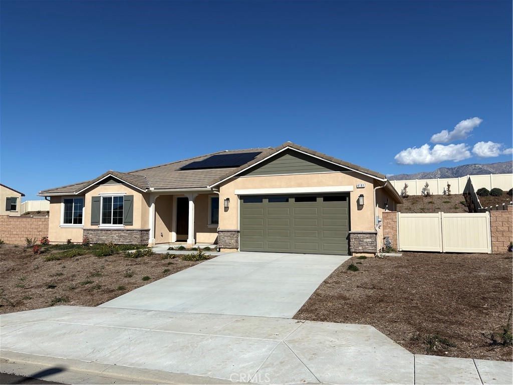 4181 Daisy Lane Banning, CA 92220 - Photo 1 of 1 a front view of a house with a yard and garage