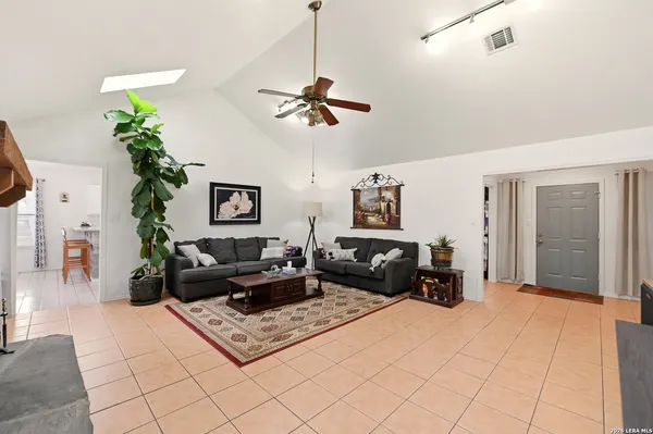 a view of a livingroom with workspace and a couch