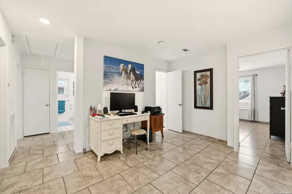 a bedroom with a bed and cabinets