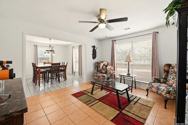 a dining room with furniture and window
