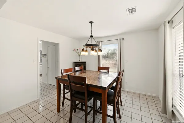 a kitchen with granite countertop a sink cabinets and stainless steel appliances
