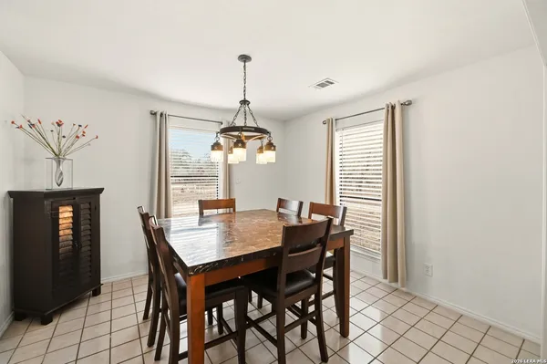 a large kitchen with stainless steel appliances kitchen island granite countertop a sink and cabinets