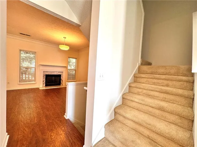 a view of an entryway with wooden floor