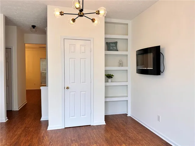 a view of a livingroom with wooden floor