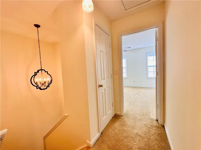 a view of a room with a shower and wooden floor