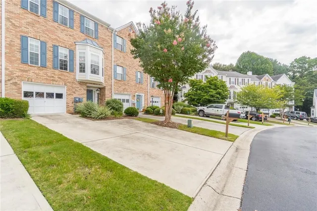 a view of swimming pool with outdoor seating and a tree