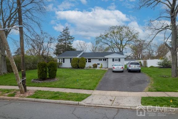 92 Kendall Road Kendall Park, NJ 08824 - Photo 17 of 28 view of front of house featuring a garage and a front lawn