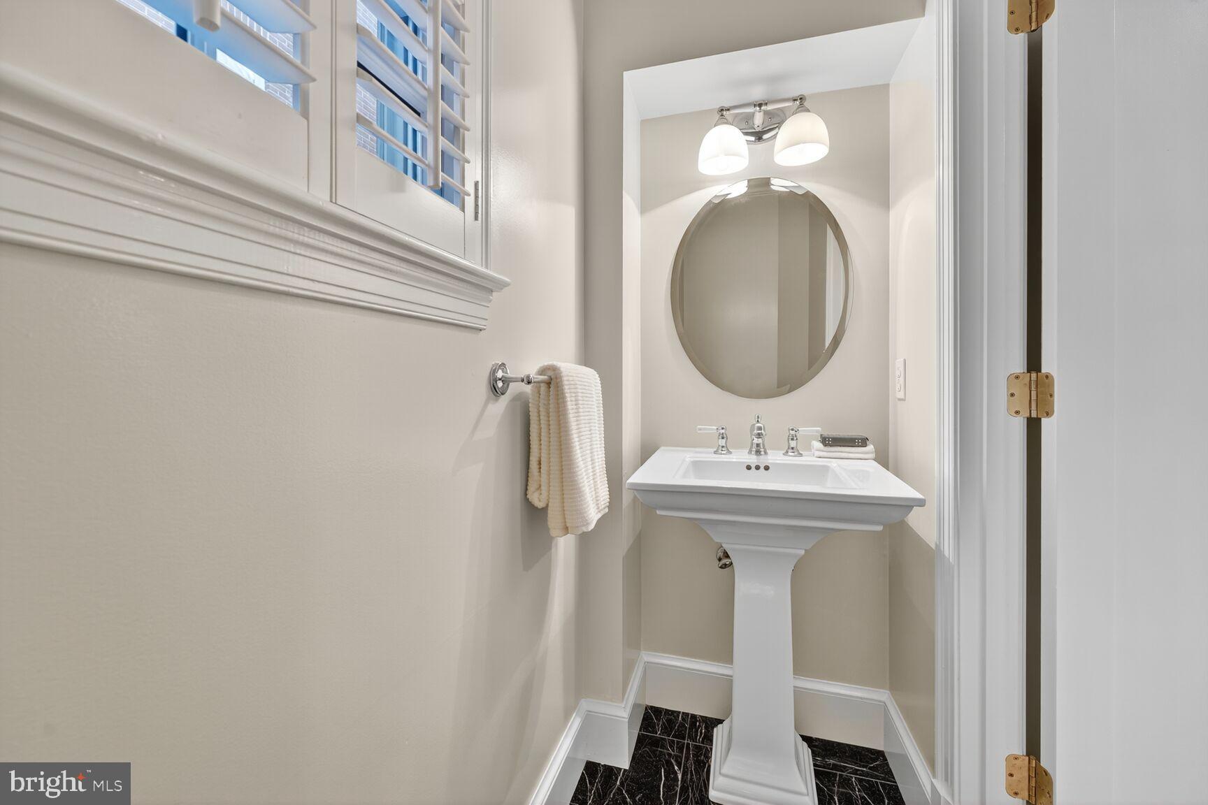 3293 Worthington Street Northwest Washington, DC 20015 - Photo 11 of 45 a bathroom with a sink and a mirror