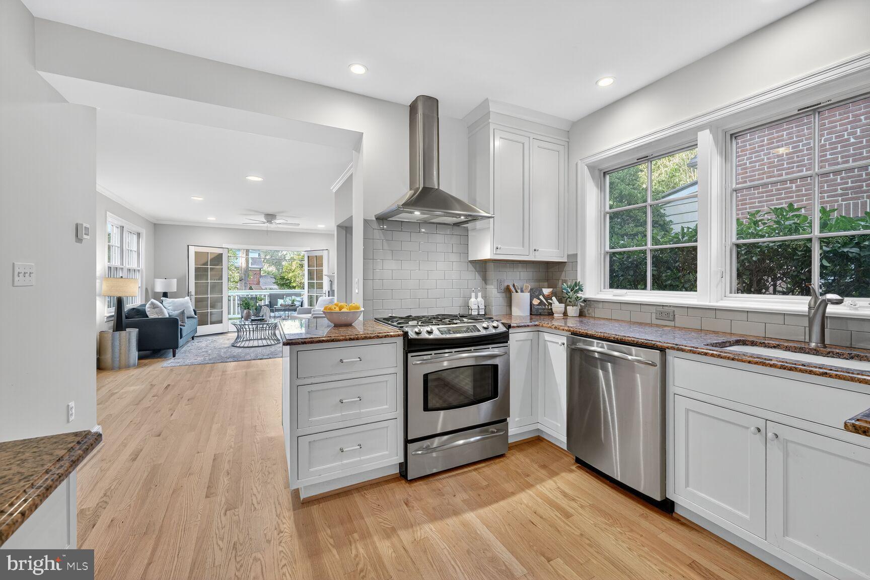 3293 Worthington Street Northwest Washington, DC 20015 - Photo 2 of 45 a kitchen with stainless steel appliances granite countertop a stove and more cabinets