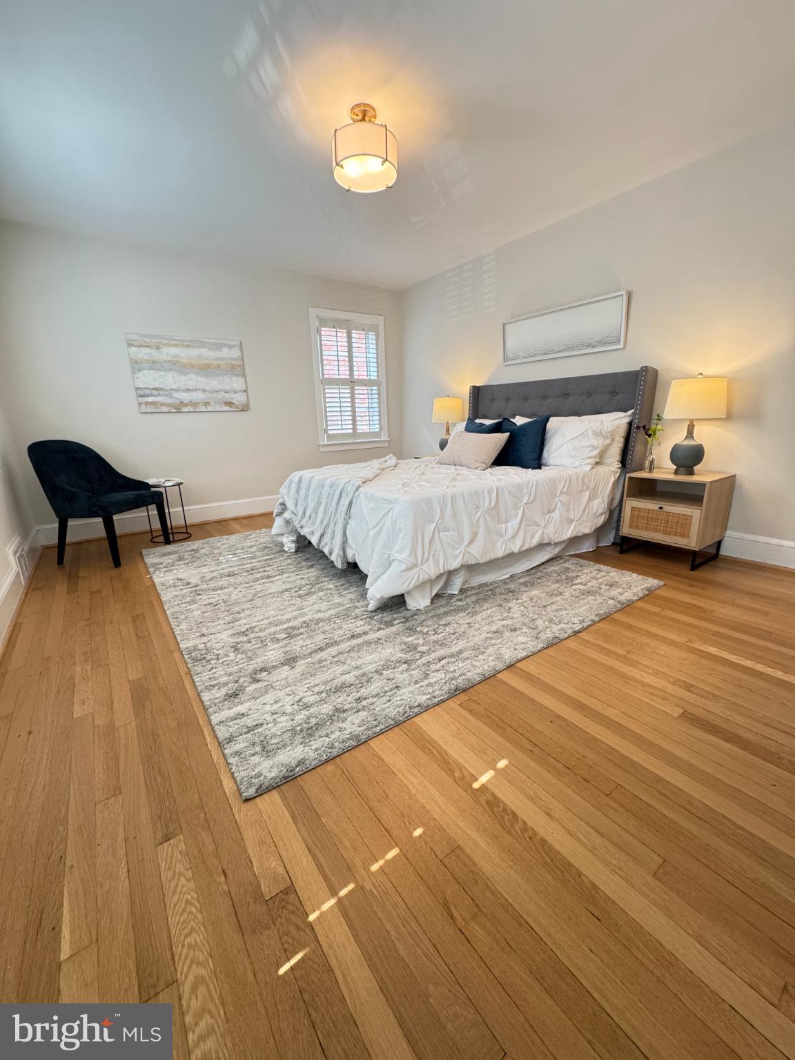 3293 Worthington Street Northwest Washington, DC 20015 - Photo 21 of 45 a bedroom with a bed and wooden floor
