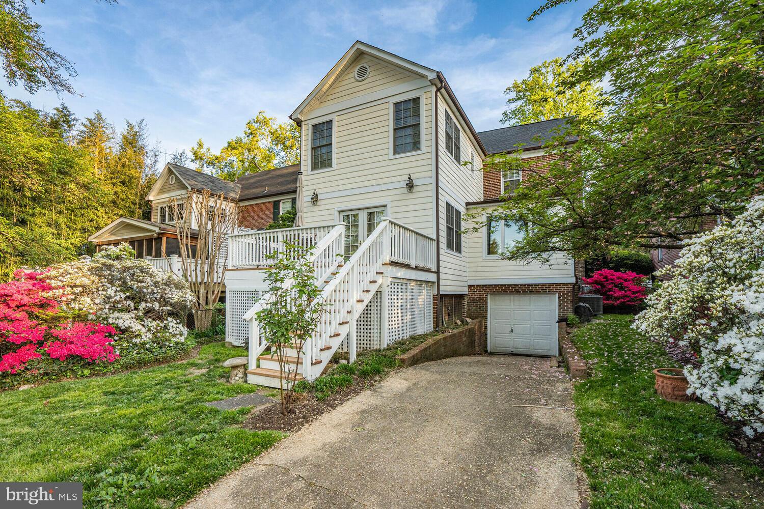 3293 Worthington Street Northwest Washington, DC 20015 - Photo 35 of 45 a front view of a house with a yard and fountain