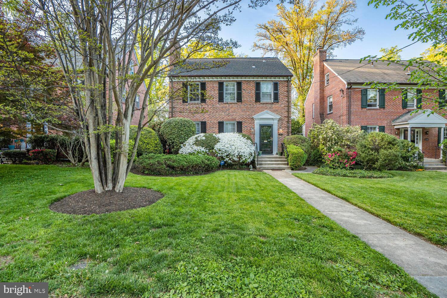 3293 Worthington Street Northwest Washington, DC 20015 - Photo 39 of 45 a front view of a house with a garden and tree