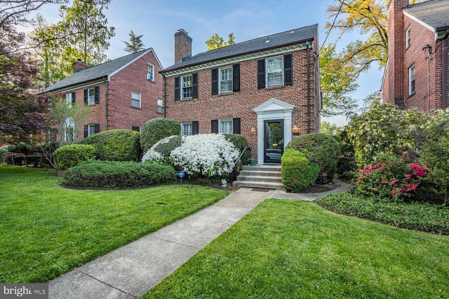 3293 Worthington Street Northwest Washington, DC 20015 - Photo 41 of 45 a front view of a house with a garden