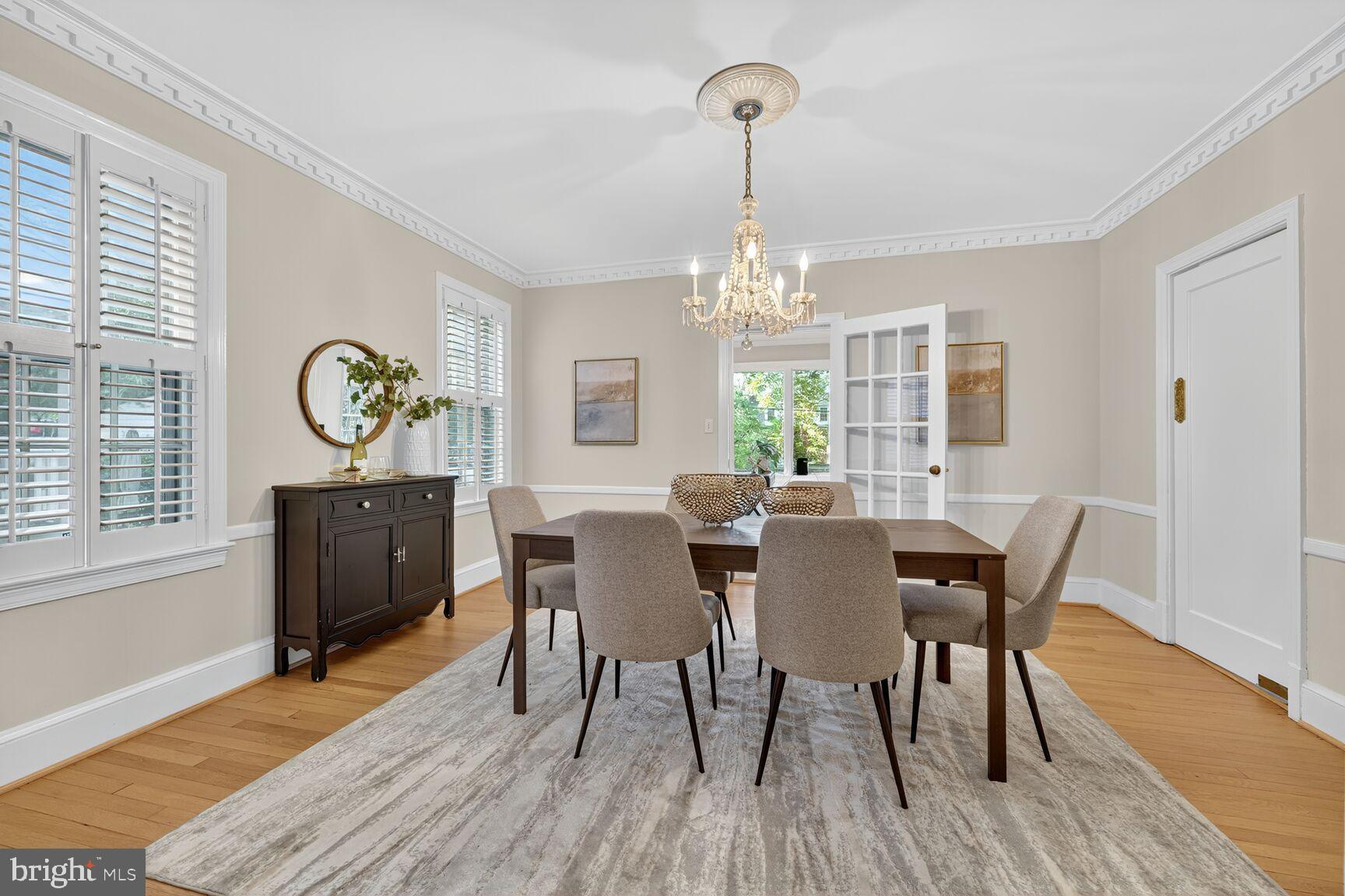 3293 Worthington Street Northwest Washington, DC 20015 - Photo 9 of 45 a view of a dining room with furniture a chandelier and wooden floor