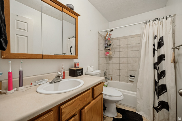 6709 Acoma Road, Unit 239 Midvale, UT 84047 - Photo 29 of 38 6709 - Main level bathroom. Wood-finish vanity with an integrated sink and laminate countertop