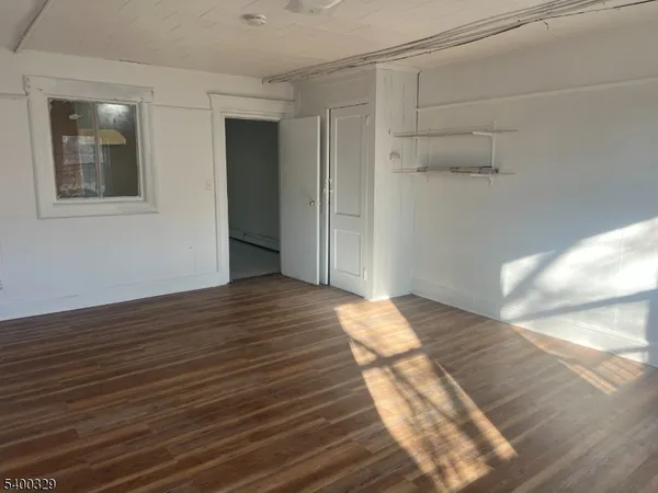 a view of a big room with wooden floor
