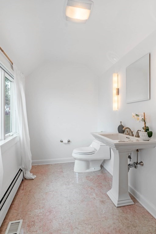 13 Goldthwait Road Marblehead, MA 01945 - Photo 20 of 40 a bathroom with a sink a toilet and mirror
