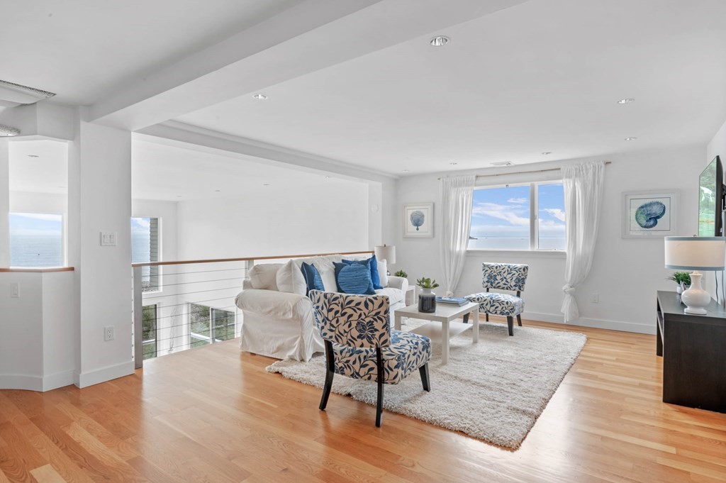 13 Goldthwait Road Marblehead, MA 01945 - Photo 22 of 40 a living room with furniture wooden floor and a lamp