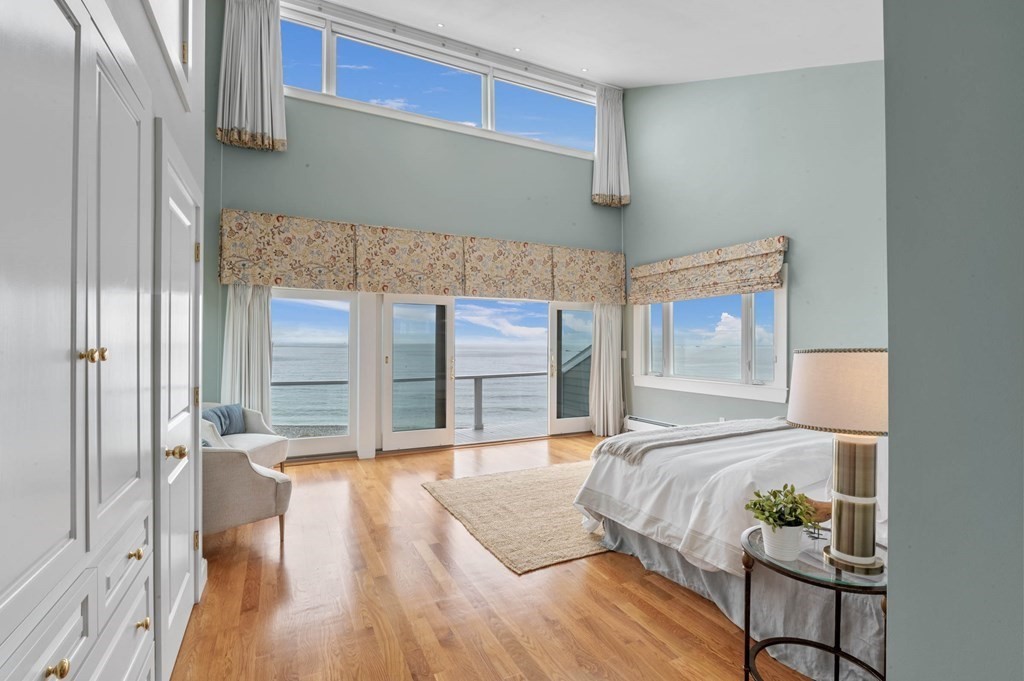 13 Goldthwait Road Marblehead, MA 01945 - Photo 34 of 40 a bedroom with a bed and a mirror