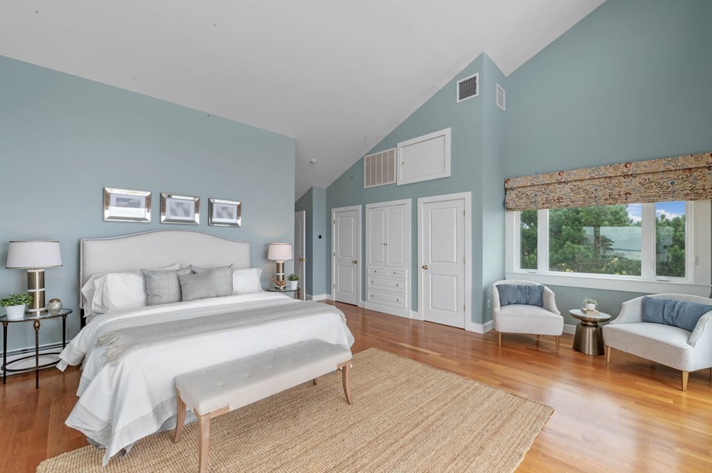 13 Goldthwait Road Marblehead, MA 01945 - Photo 36 of 40 a spacious bedroom with a bed a couch and a large window with outer view