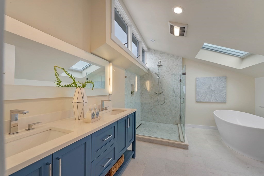 13 Goldthwait Road Marblehead, MA 01945 - Photo 38 of 40 a bathroom with a granite countertop sink a toilet a mirror and shower