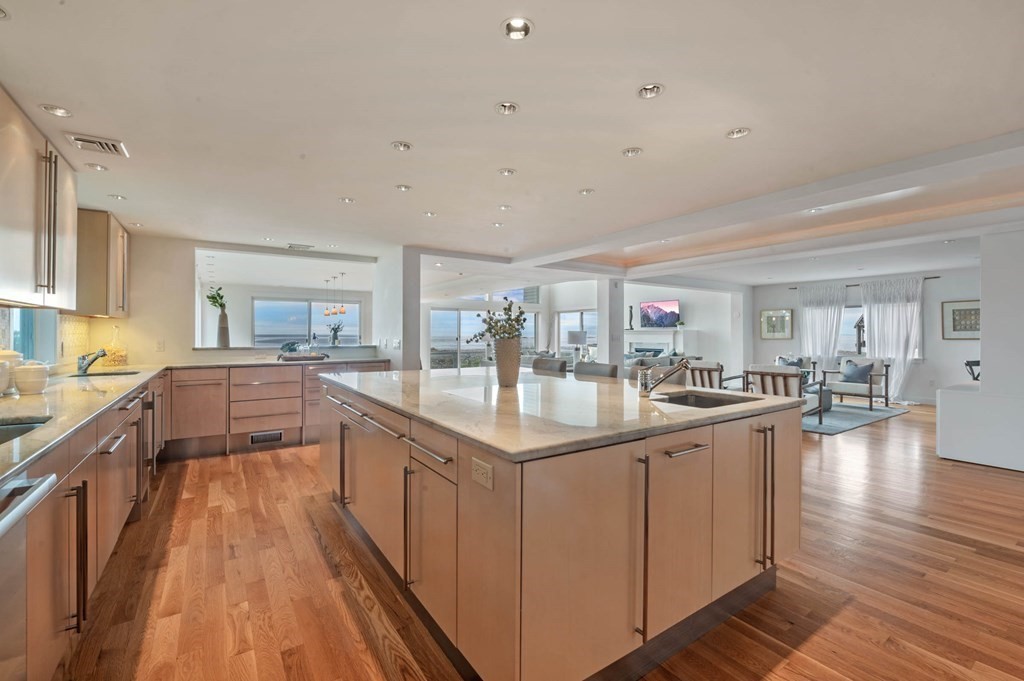 13 Goldthwait Road Marblehead, MA 01945 - Photo 10 of 40 a kitchen with counter top space a sink appliances and cabinets