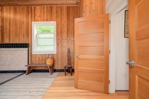a bathroom with a toilet sink and shower curtain
