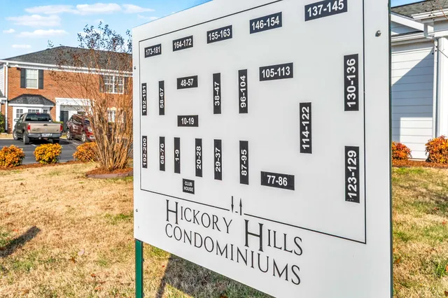 a street sign on a wall next to a building